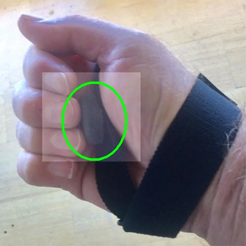 Bluetooth Tiny Switch hand strap positioning for assistive switch access