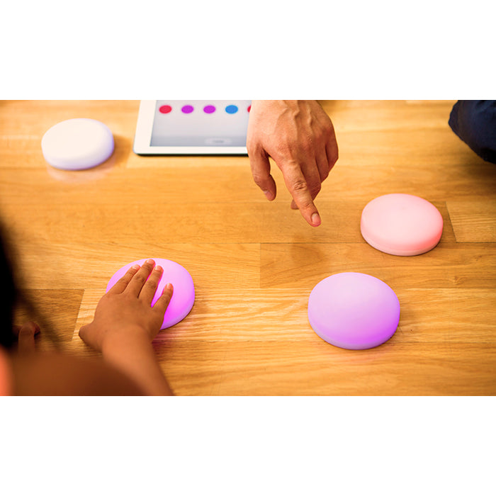 Cosmo Dots wireless switches lighting up during an interactive activity