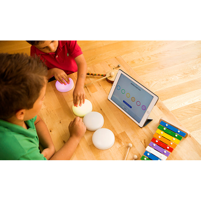 Children using Cosmo Dots with the Cosmo Learning System on an iPad
