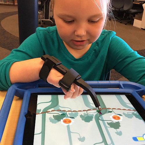 Child using Limitless Stylus adaptive touchscreen stylus on a tablet